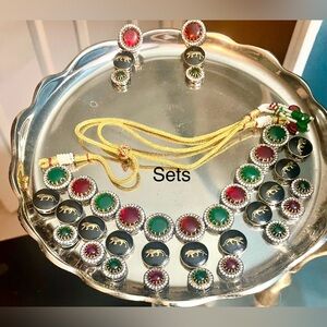 Elegant Gold and Silver Jewelry Set with Red and Green Accents